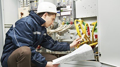 Electrician checking cabling power line